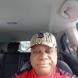 A picture of me.  In my Burberry baseball cap