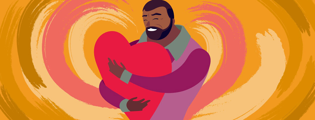 a large older man with HIV holds a giant heart and hugs it
