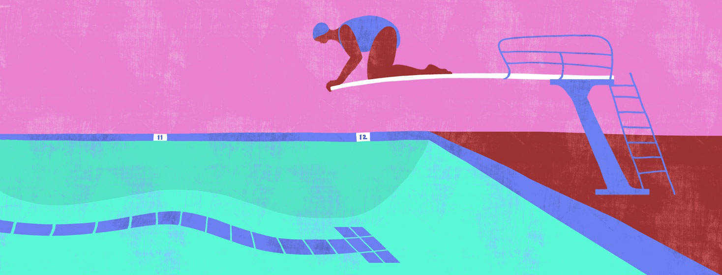 a diver cowering on a diving board.