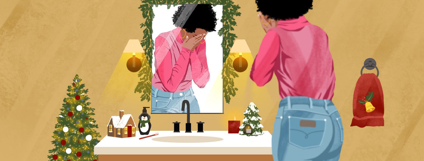 a woman cries in a bathroom decorated for the holidays