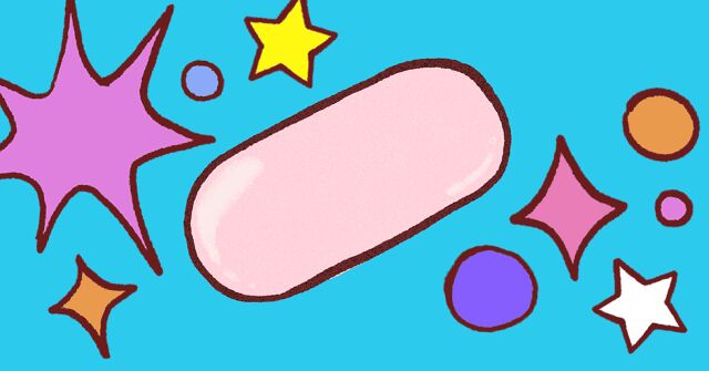 A pink pill surrounded by bursts and sparkles